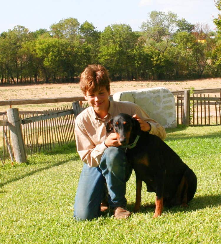 Buster family with Dobermans